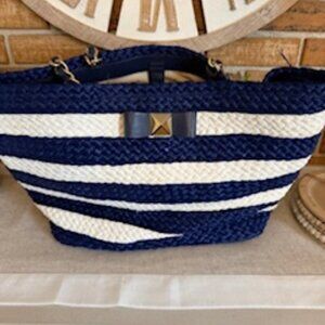Kate Spade straw tote. Color navy & cream stripe with gold trim.